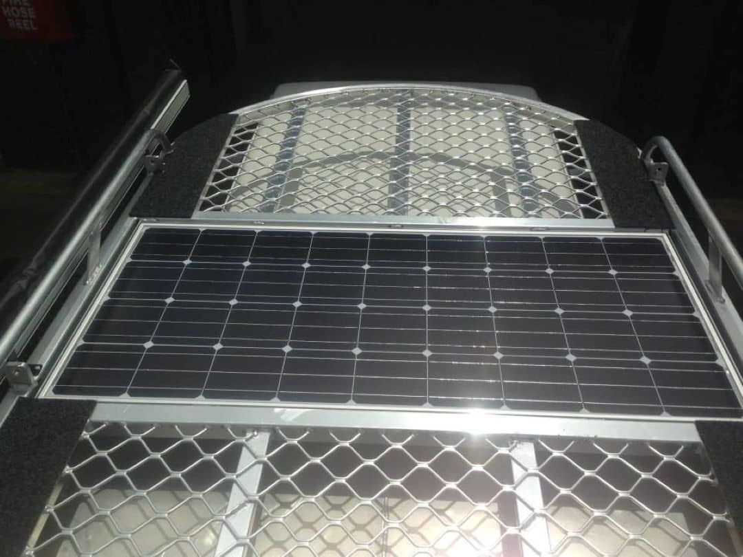 Two Solar Panels Are Sitting on Top of a Metal Cage — Boyd's Fabrications In Smithfield, QLD