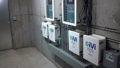 A room with a lot of electrical equipment on the wall.