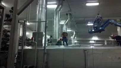 A group of men are working in a factory.