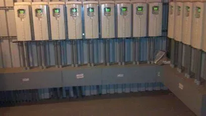 A room with a lot of electrical boxes on the wall.