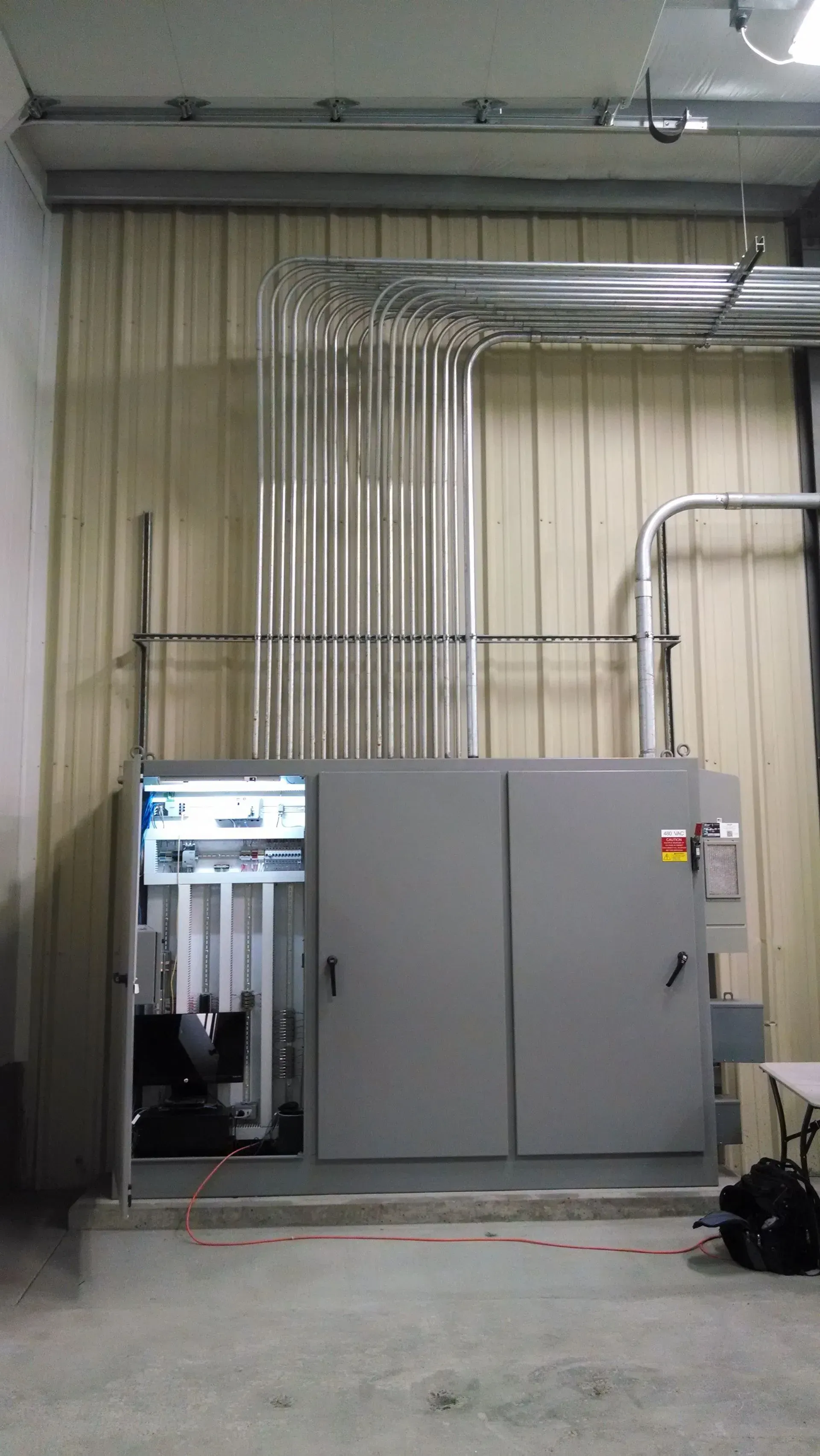 A room with a lot of pipes coming out of it.