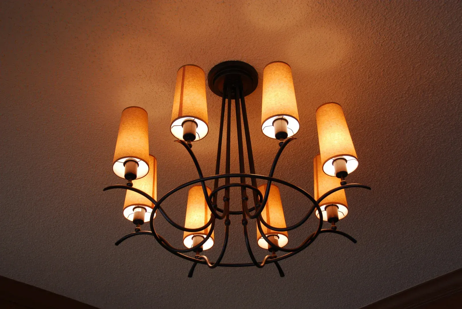 A chandelier with a lot of lights hanging from the ceiling