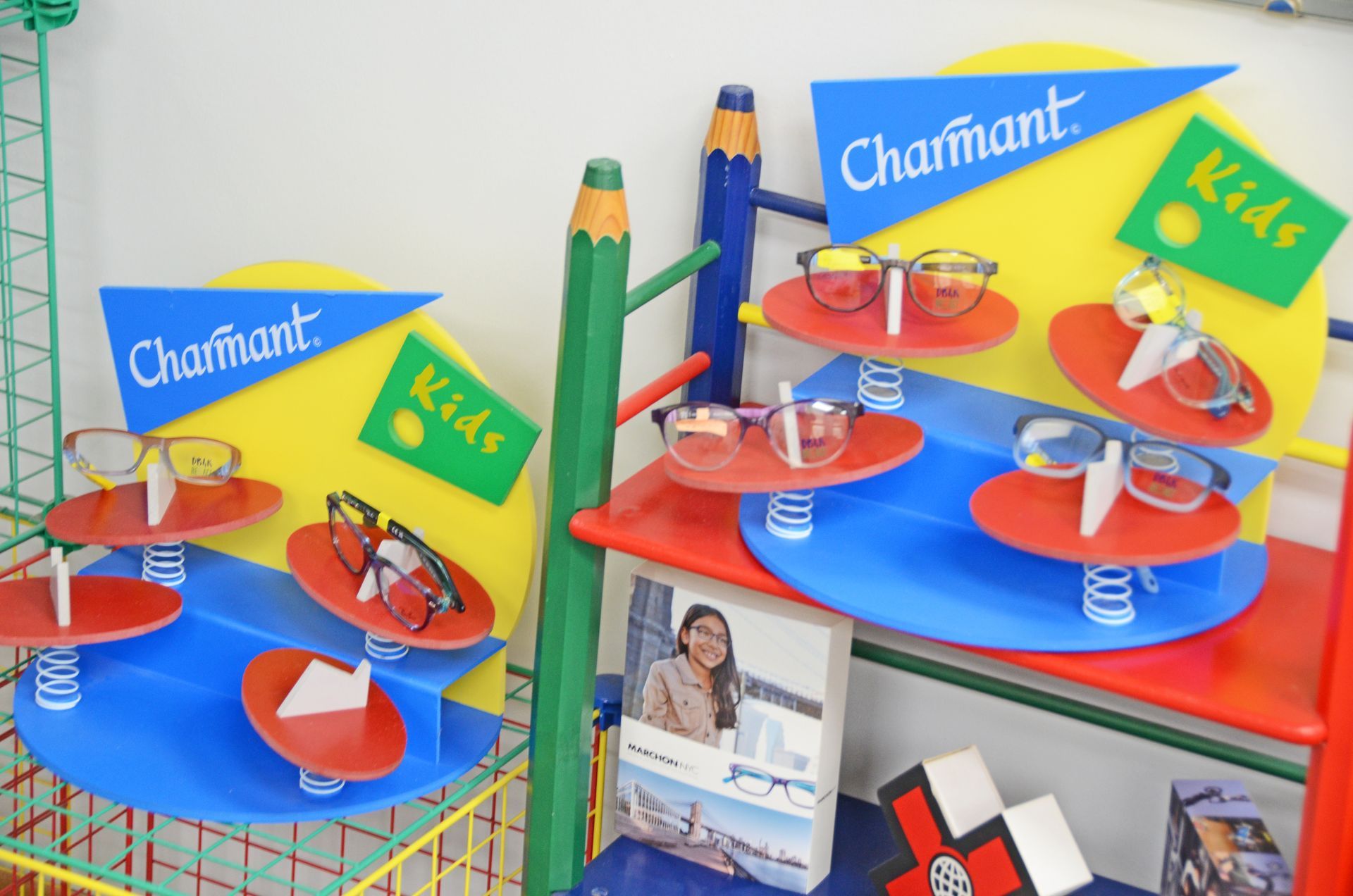 Ray-ban glasses are displayed on a glass shelf