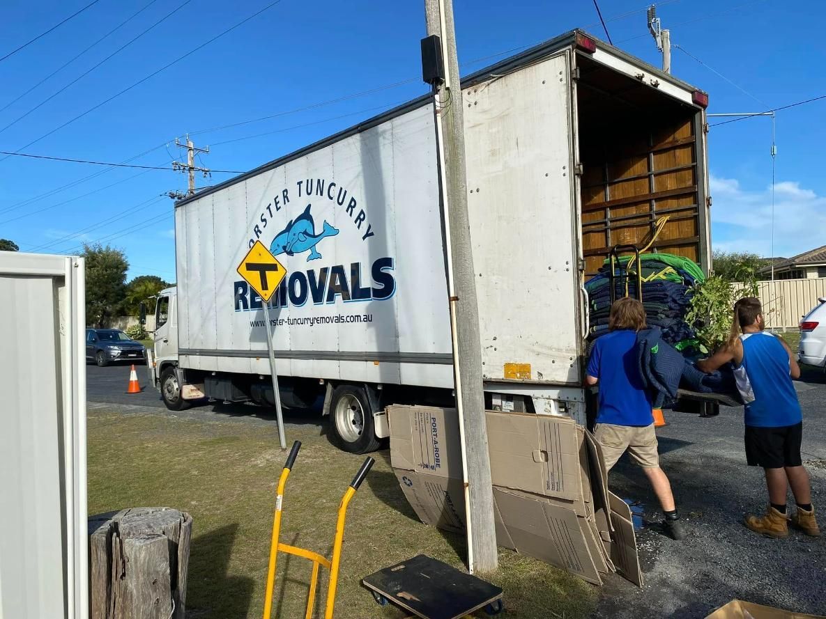 Moving Truck With Two Men Loading It on a Sunny Day — Forster Tuncurry Removals & Storage in Forster, NSW