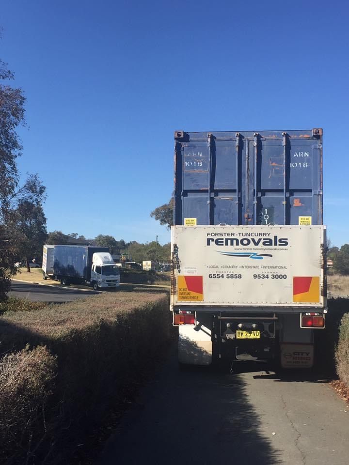 A Removals Truck is Parked on the Side of the Road — Forster Tuncurry Removals & Storage in Tuncurry, NSW