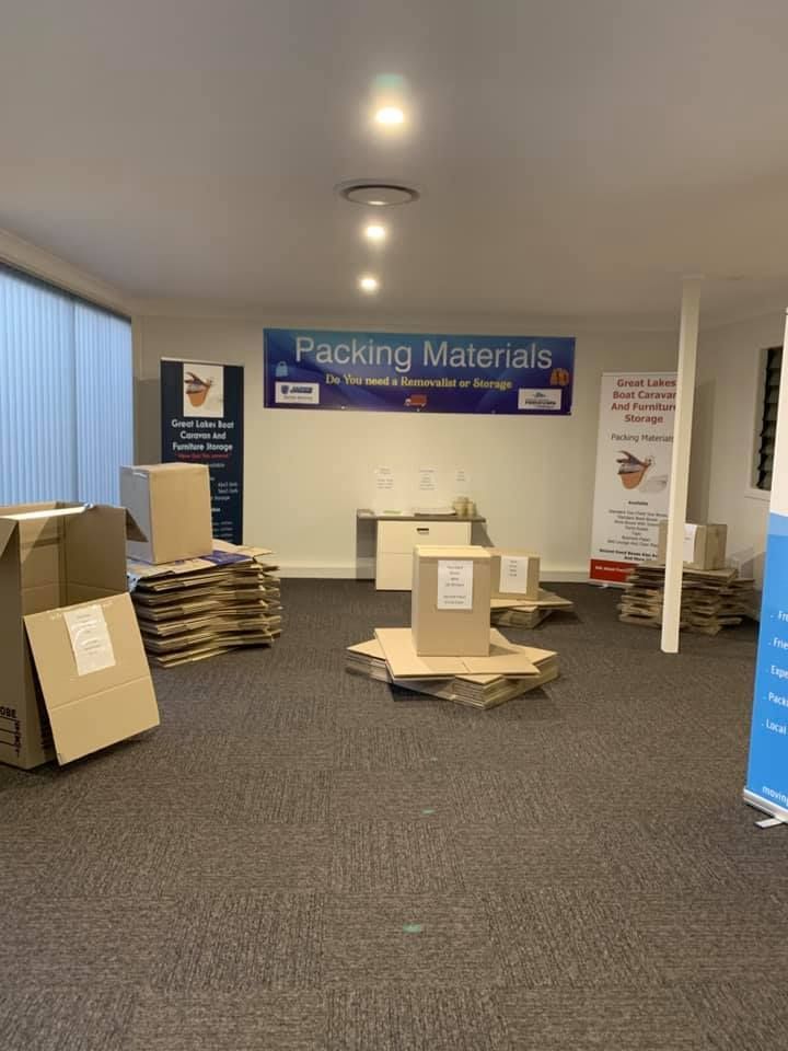 Room Filled With Cardboard Boxes and Packing Materials — Forster Tuncurry Removals & Storage in Tuncurry, NSW