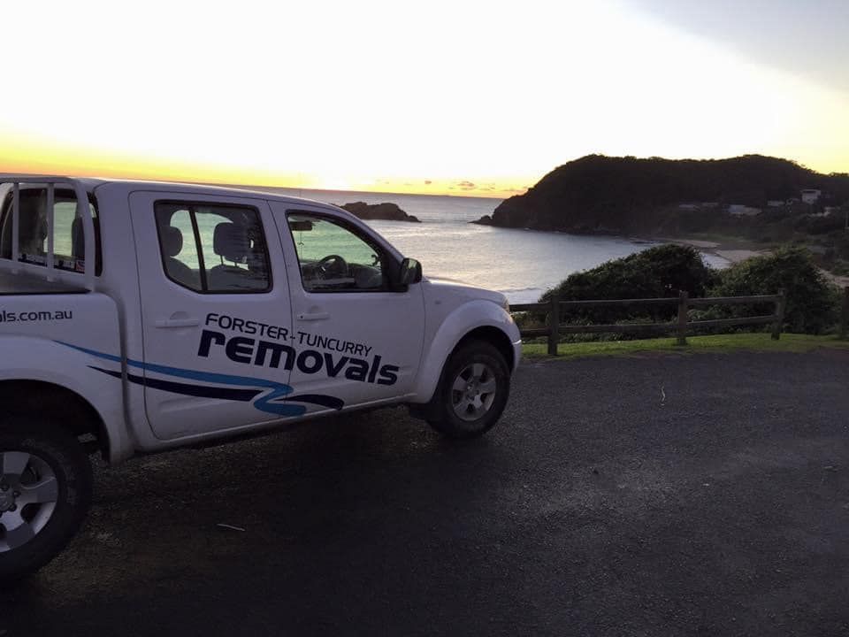 White Truck With Word Removals on the Side Parked in Front of an Ocean — Forster Tuncurry Removals & Storage in Tuncurry, NSW