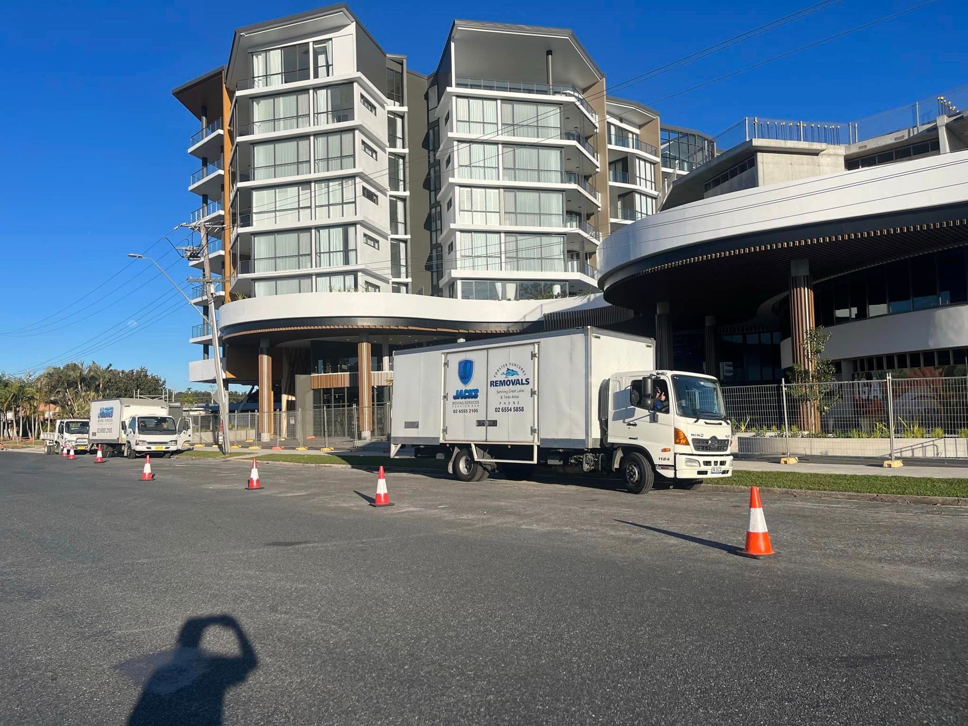 A White Truck is Parked in a Parking Lot in Front of a Building — Forster Tuncurry Removals & Storage in Tuncurry, NSW