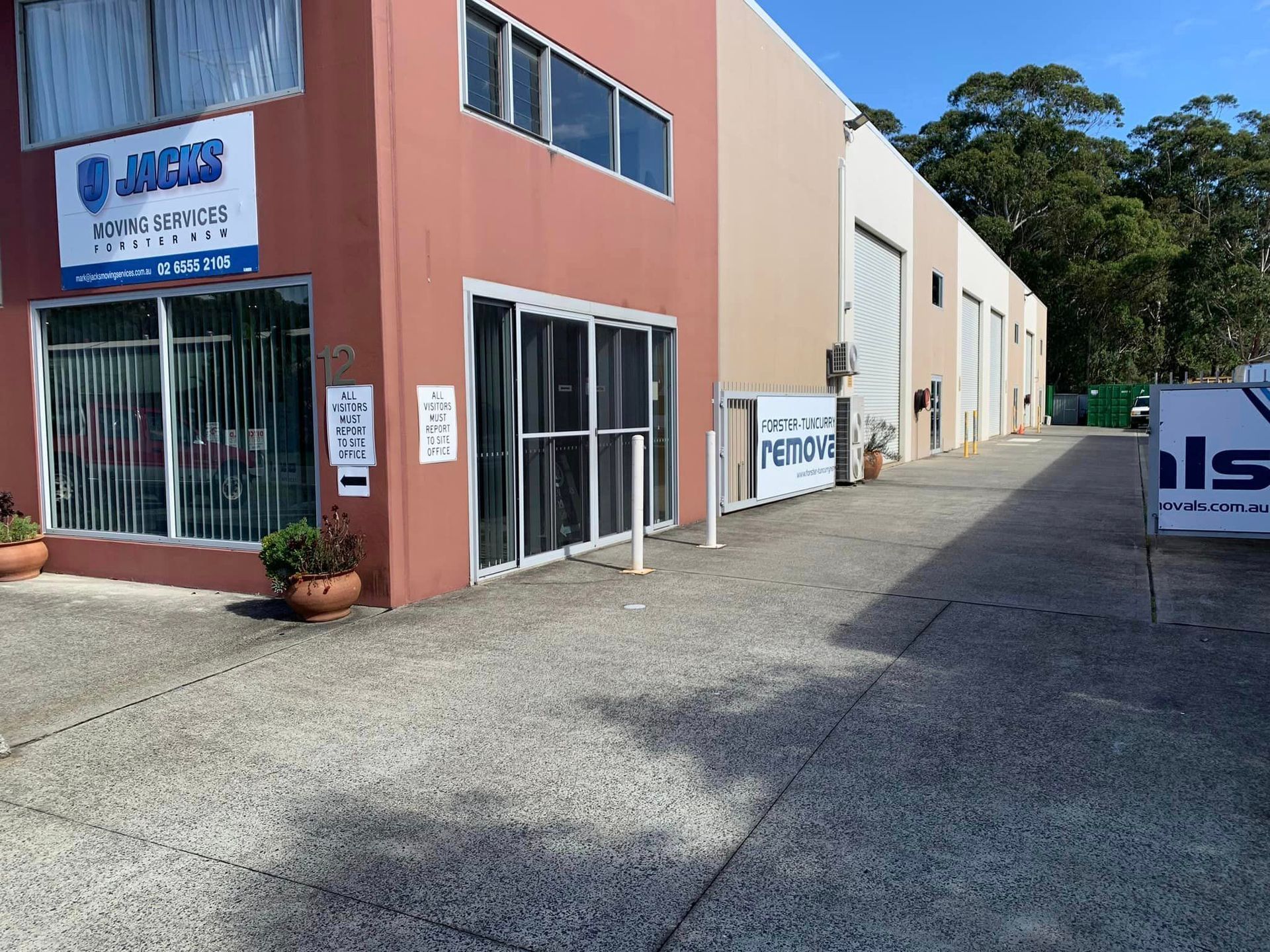 A Building With a Sign That Says Jacks Moving Services — Forster Tuncurry Removals & Storage in Tuncurry, NSW