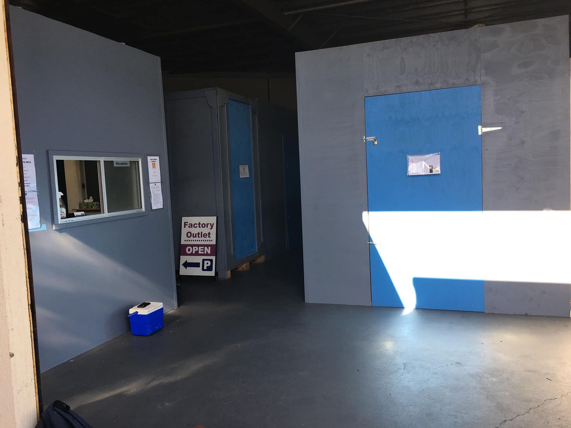 Storage Room With Blue Doors, Grey Walls, and a Window — Forster Tuncurry Removals & Storage in Tuncurry, NSW