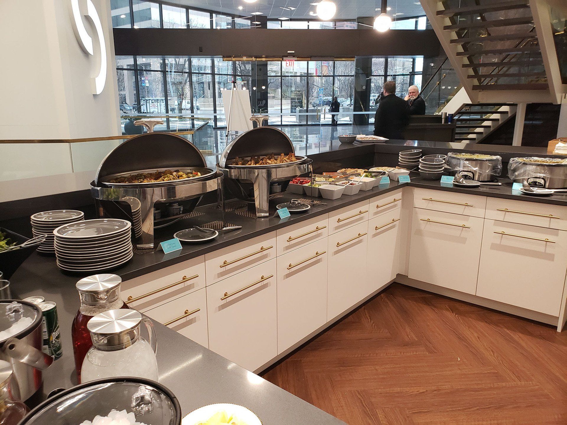 A buffet line in a restaurant with a lot of food on it.