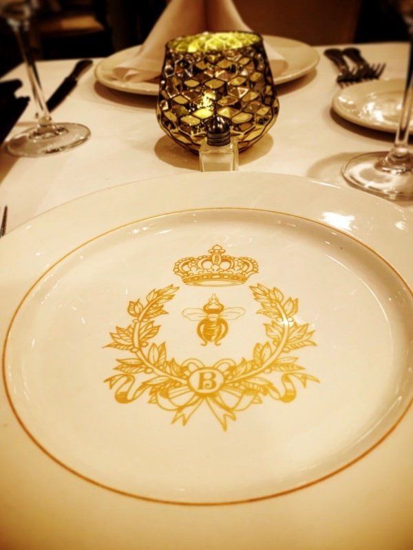 Broussards Restaruant plate with bee emblem
