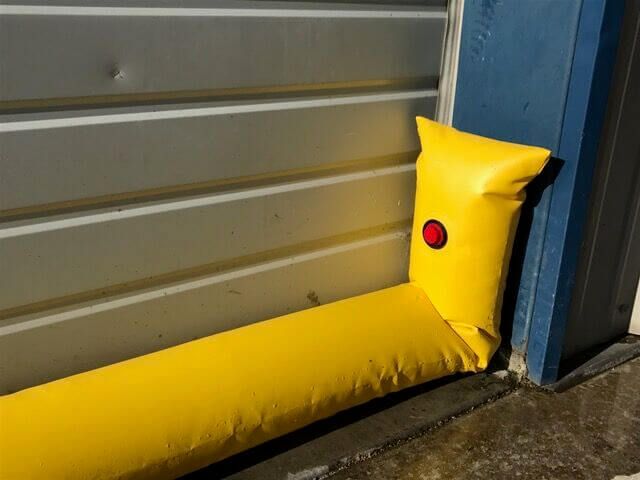 How to protect a door from flooding with water filled flood barriers