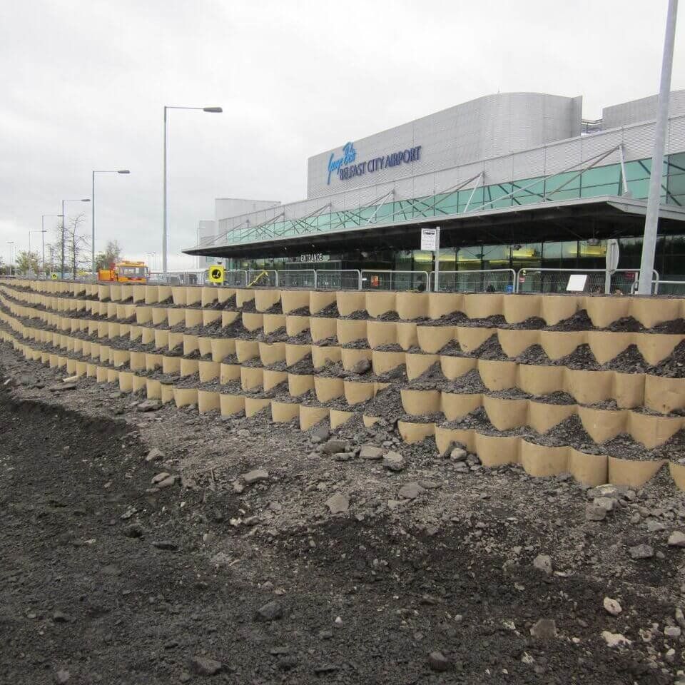 Soil Filled Flood Barrier similar to sandbags that is also a ballistic barrier for force protection