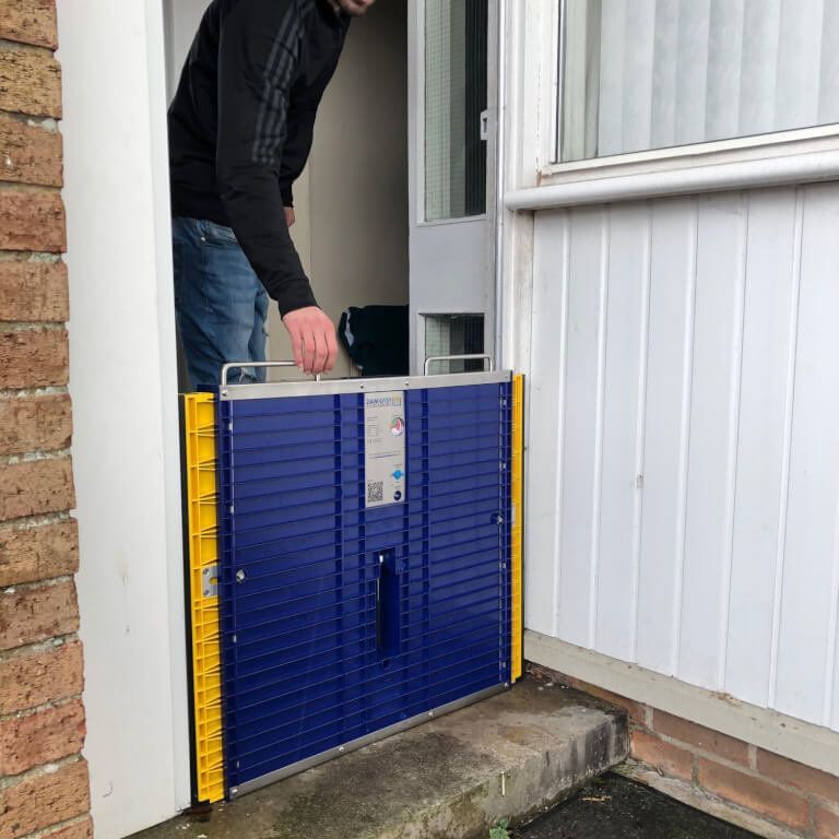 Flood barriers for homes to quickly protect a door from flooding