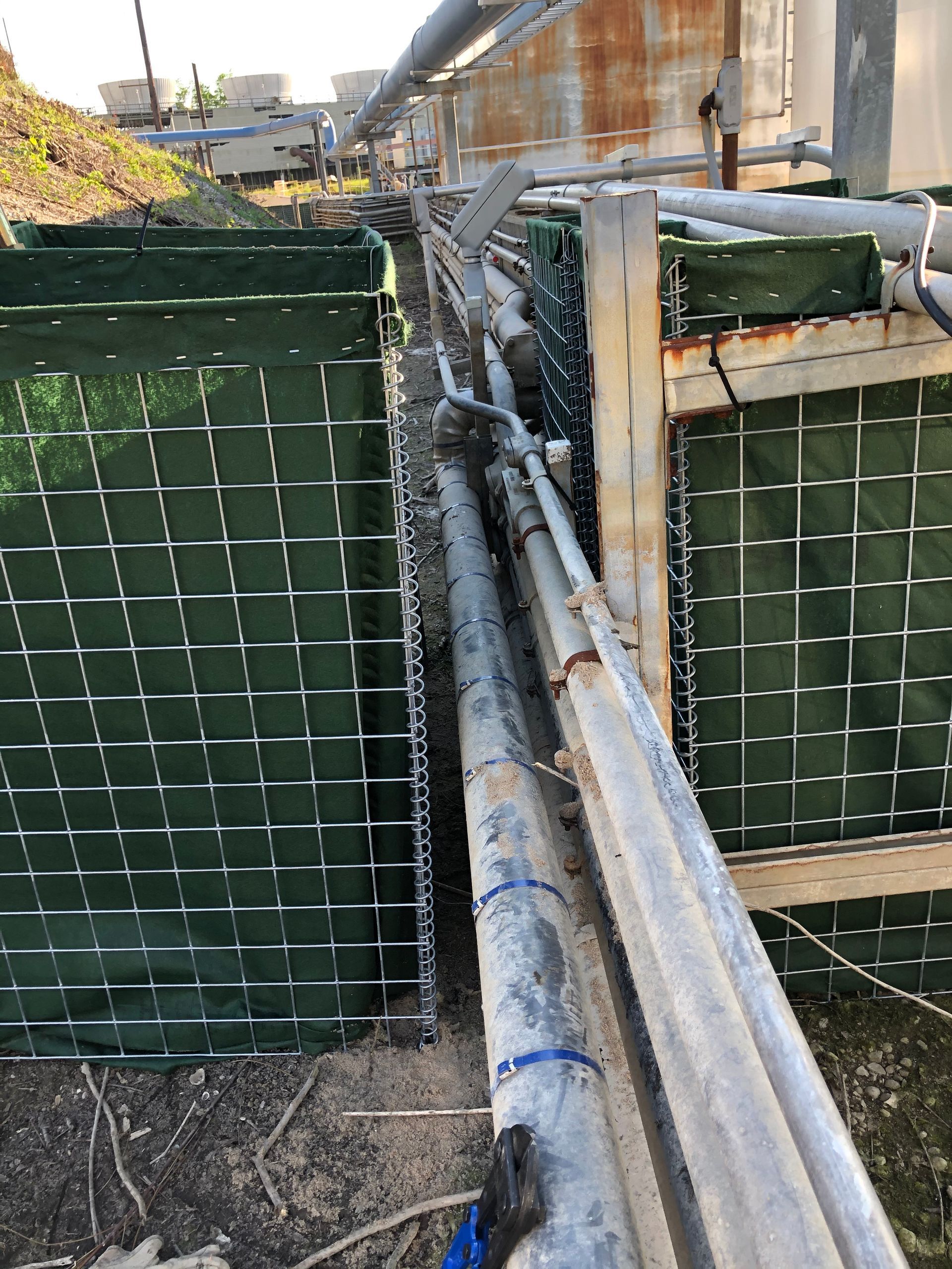 How to protect pipes and critical infrastructure from flooding using a modified HESCO Flood Barrier