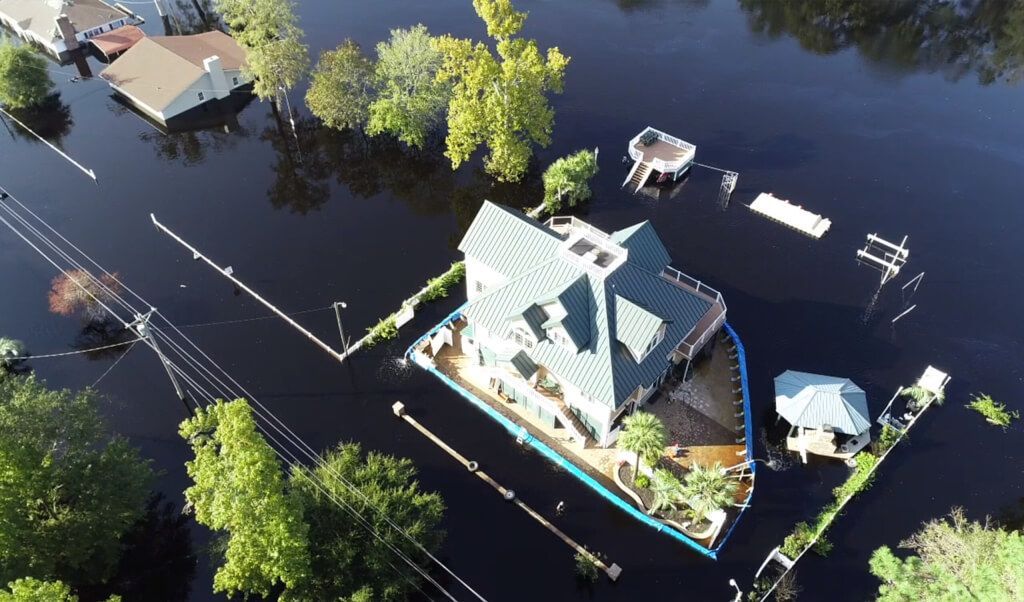 Overhead view of Geo Design Flood Barriers protecting a house from flooding in the USA