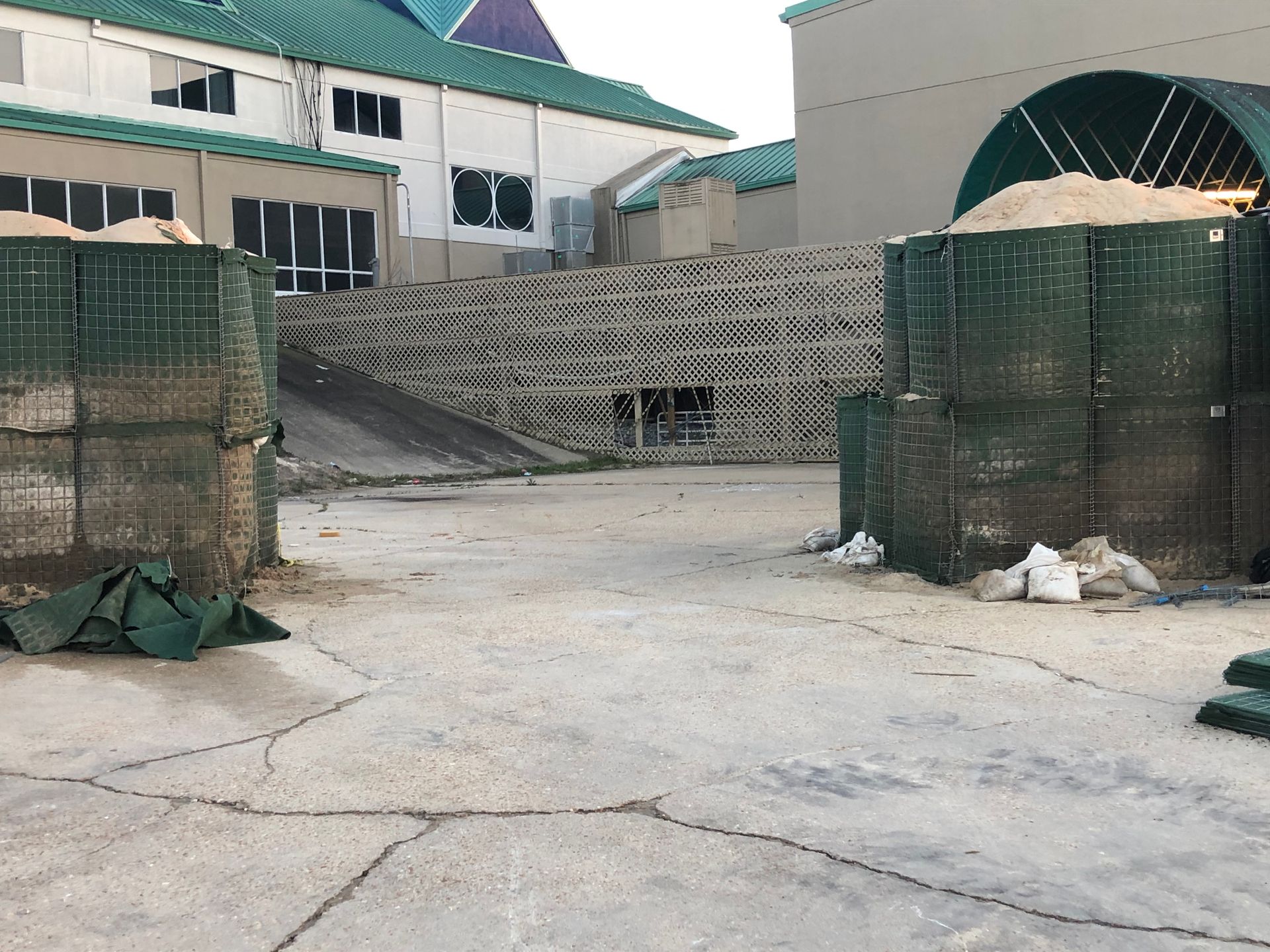 HESCO Bastion Flood Barrier Gap Closure to protect a building from flooding before being closed  