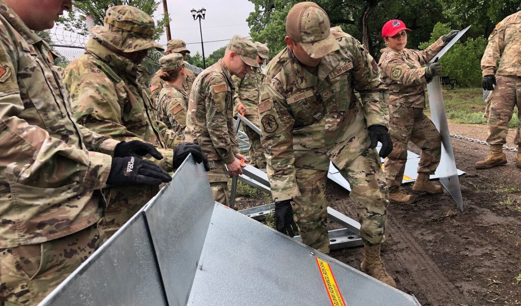 New Mexico National Guard deploys the Geodesign Flood Barrier in Las Vegas, NM to redirect debris flows from burn scar areas.
