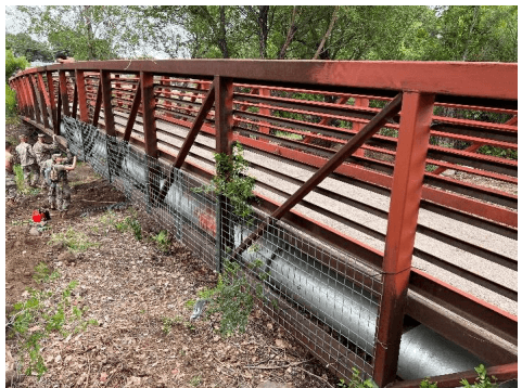 This is not a typical application. Sewage pipes below a bridge needed to be protected from expected debris flow so we took apar the HESCO and attached the panels to the bridge allowing water to pass through but preventing debris impact