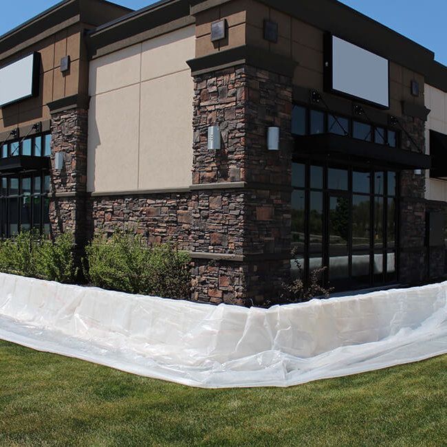 Example of how to protect a building from flooding using the Muscle Wall flood barrier
