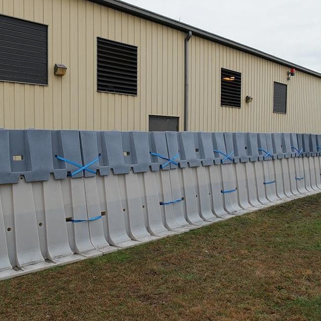 Example of the 2' tall extension attached to the 4' tall flood barrier to provide 6' of flood protection.