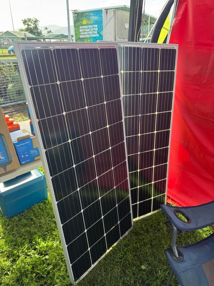 Two Solar Panels Are Sitting on Top of a Grass Covered Field — Edmonton Battery Centre In Bentley Park, QLD
