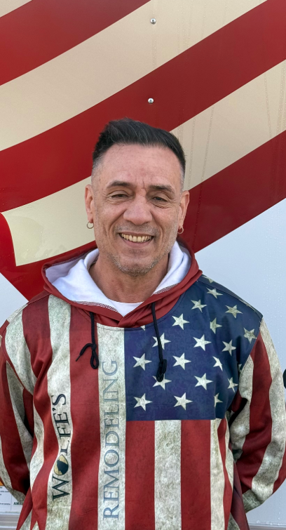 Silhouette of a person with a blurred face and shoulders, on a light gray background.