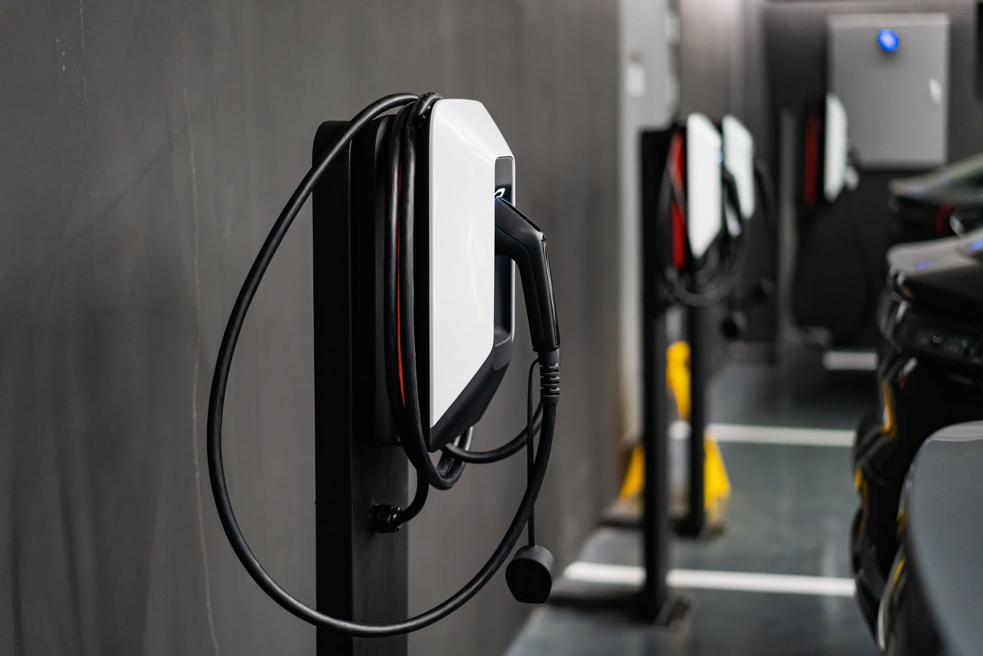 An electric car is being charged at an ev charging station.