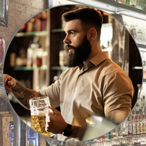 Barman pouring a pint of beer