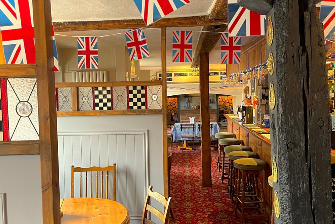 Internal view of The Chequers Inn, with Union Jack bunting for celebration