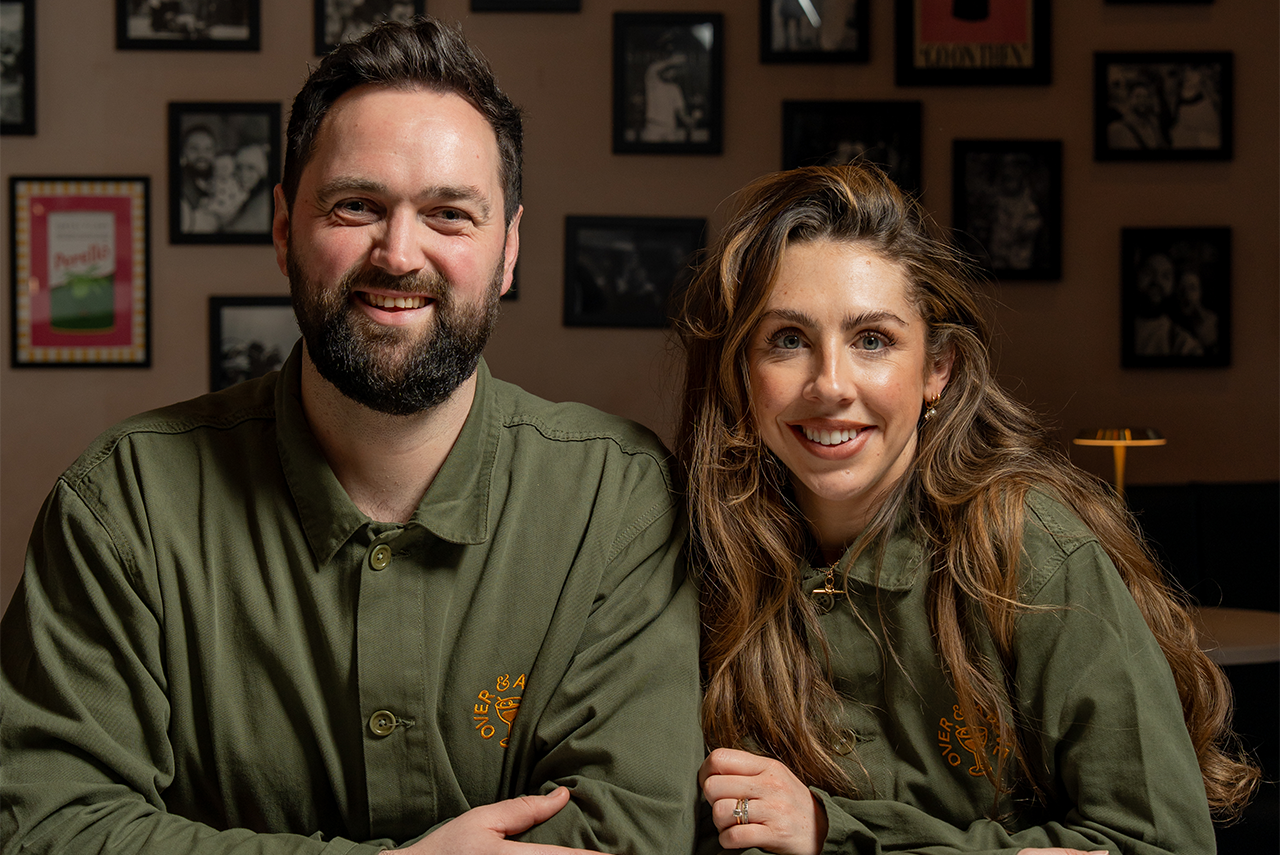 Four people toasting drinks: beer and cocktails