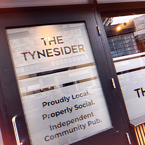 Pub sign reading “THE TYNESIDER” with the slogan “Proudly Local. Properly Social.”