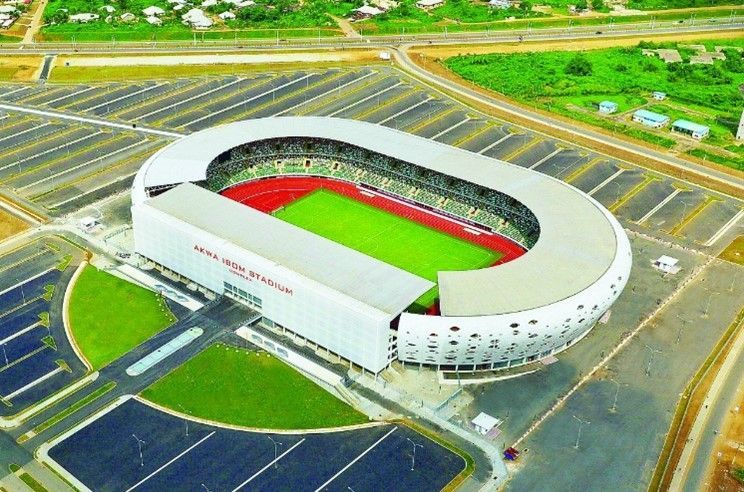 An aerial view of a stadium with a lot of parking spaces around it