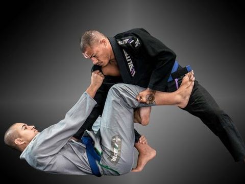 Men in Jiu Jitsu sparring