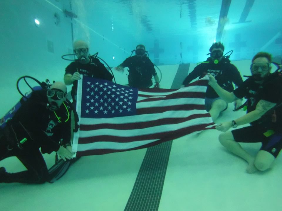 Scuba divers with USA flag