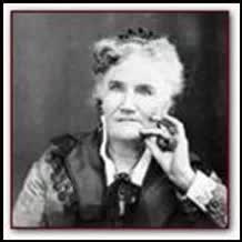 A black and white photo of an older woman talking on a cell phone.