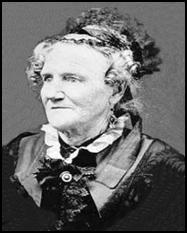 A black and white photo of an older woman wearing a hat.