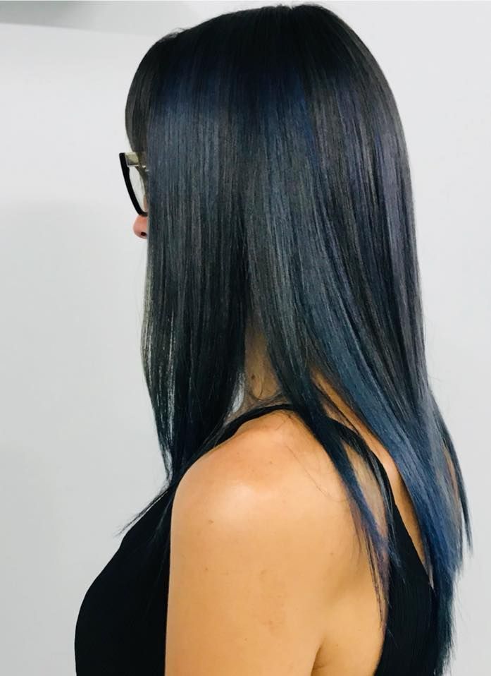 A Woman With Blue Hair And Glasses Is Wearing A Black Tank Top — Klic's Hair Design In Earlville, QLD
