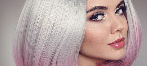 A Woman With White And Pink Hair Is Looking At The Camera — Klic's Hair Design In Earlville, QLD