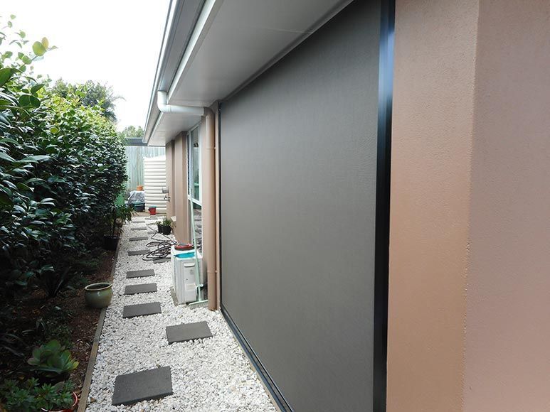 Exterior View of a House With a Retracted Grey Shade — Toowoomba Shade & Canvas in Harristown, QLD
