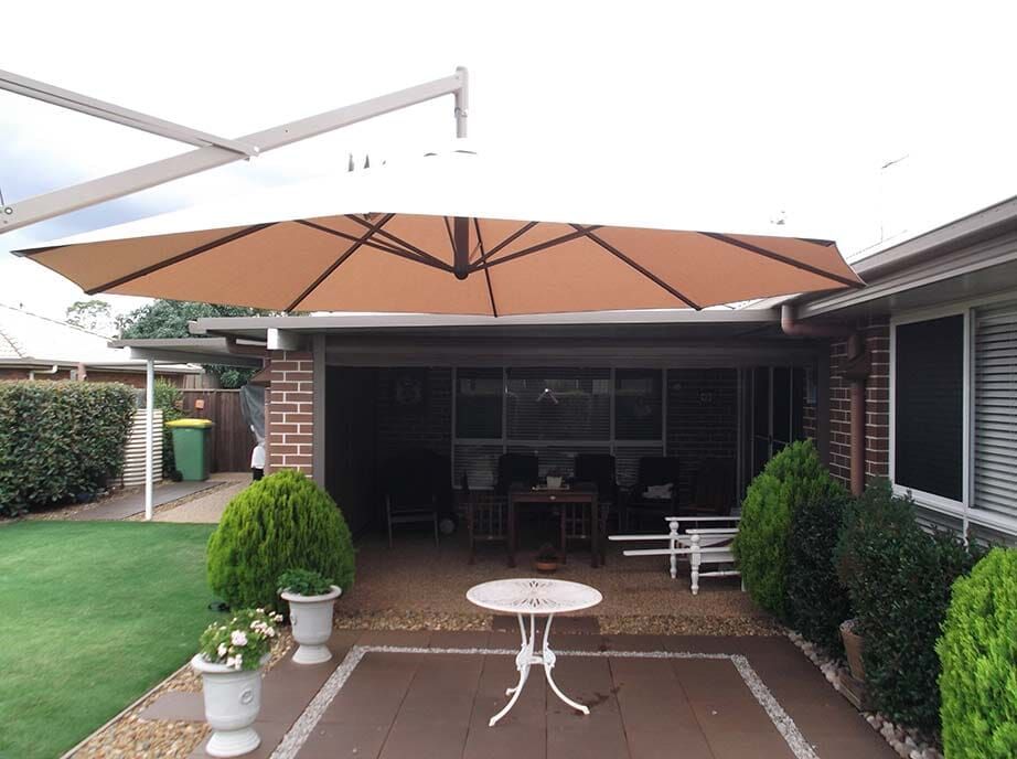 Patio With Open Brown Umbrella, White Table — Toowoomba Shade & Canvas in Harristown, QLD