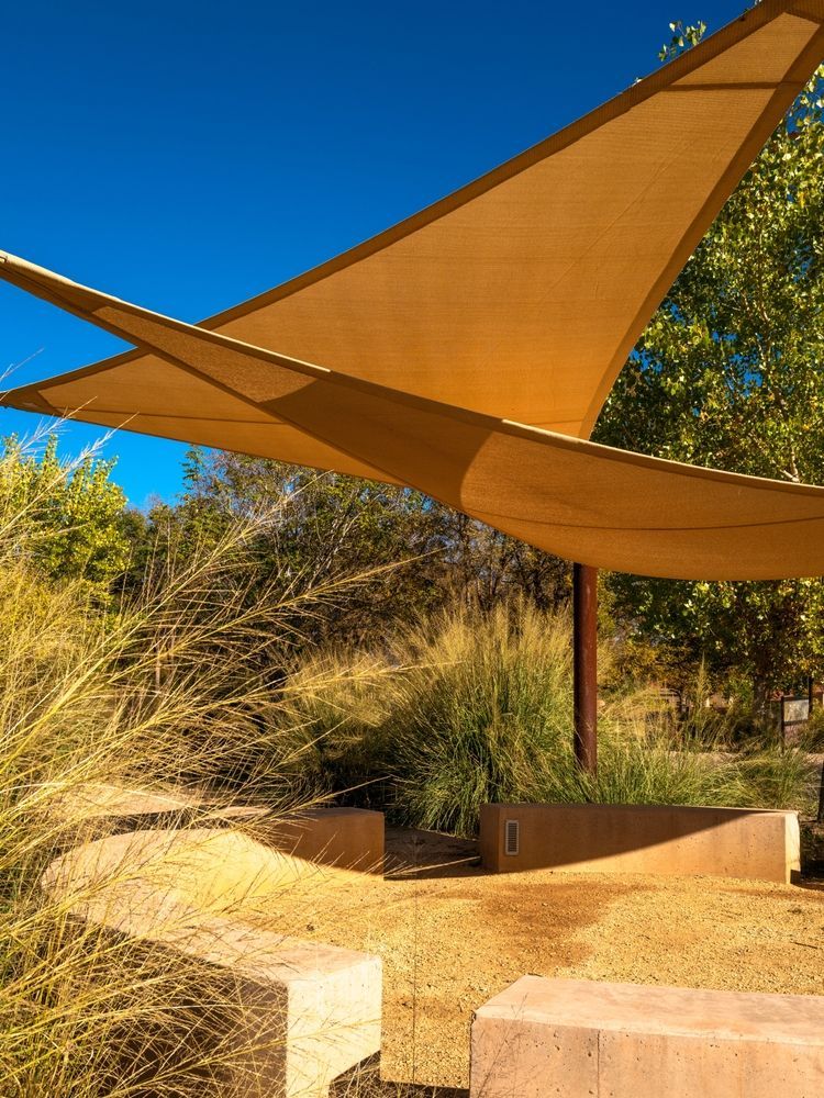Beige Shade Sails Over a Sandy Outdoor Seating Area — Toowoomba Shade & Canvas in Harristown, QLD