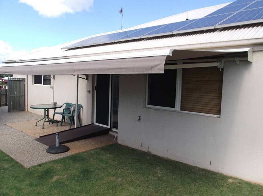 A Light-colored House With an Awning, a Ramp, a Round Table ā Toowoomba Shade & Canvas in Harristown, QLD