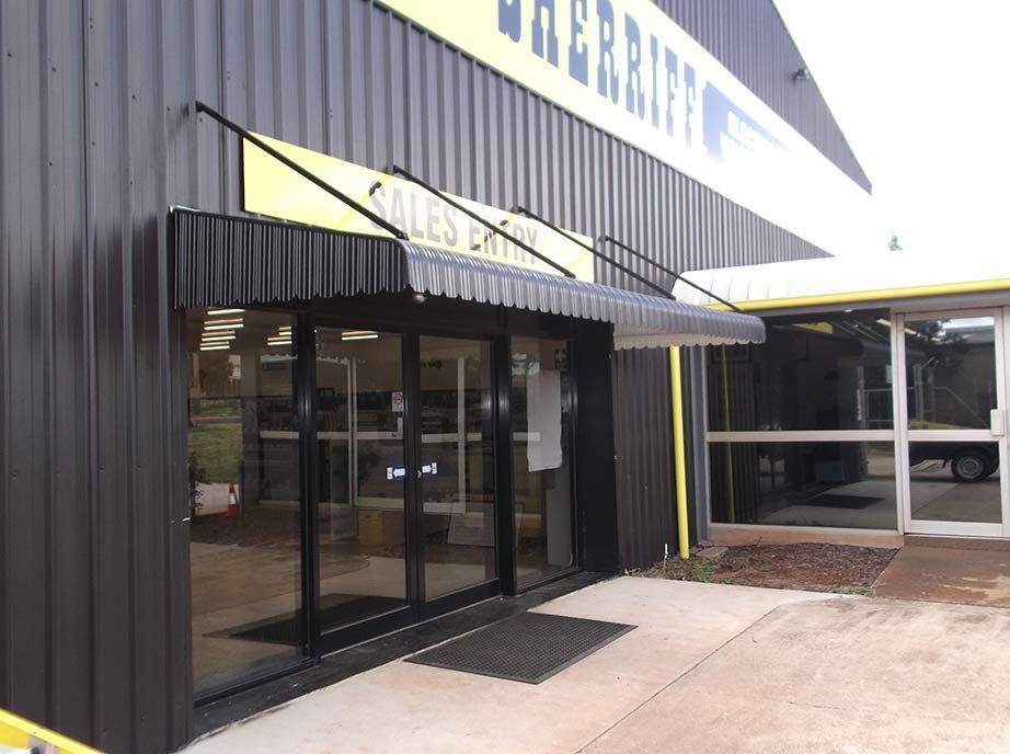 Black Building Entrance With Glass Doors, Awning — Toowoomba Shade & Canvas in Harristown, QLD