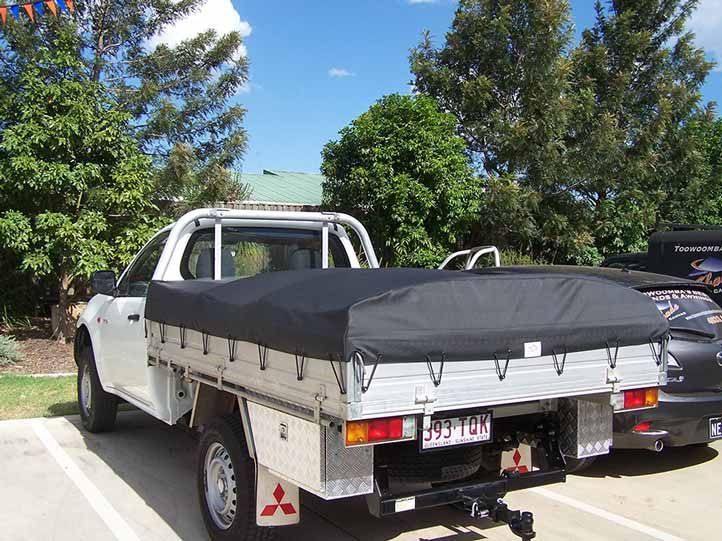 White Pickup Truck With a Black Bed Cover, Parked Outside — Toowoomba Shade & Canvas in Warwick, QLD