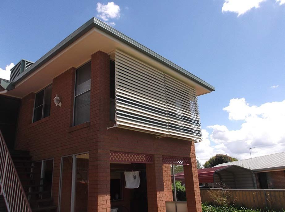 Two-story Brick House With Awning, Blue Sky — Toowoomba Shade & Canvas in Plainlands, QLD