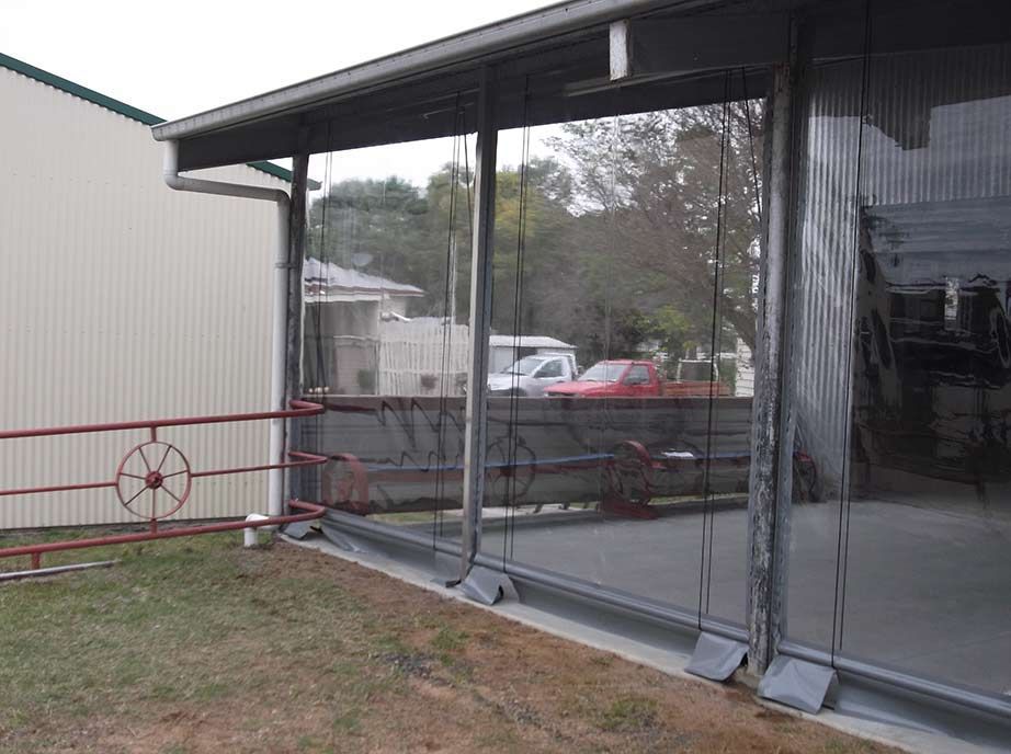 Clear Vinyl Curtains Enclose an Outdoor Structure — Toowoomba Shade & Canvas in Harristown, QLD