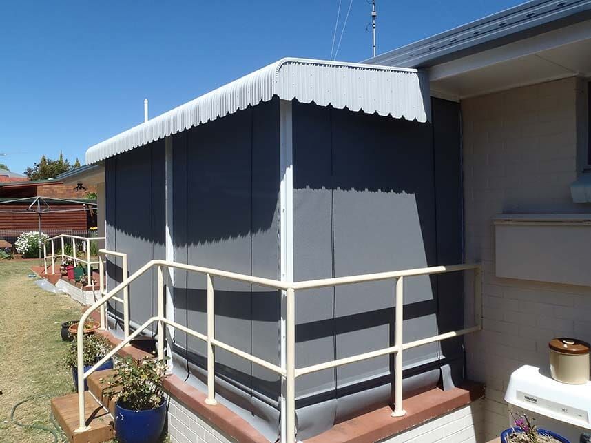 a Gray Sunroom Attached to a House, Featuring a Scalloped Awning — Toowoomba Shade & Canvas in Harristown, QLD
