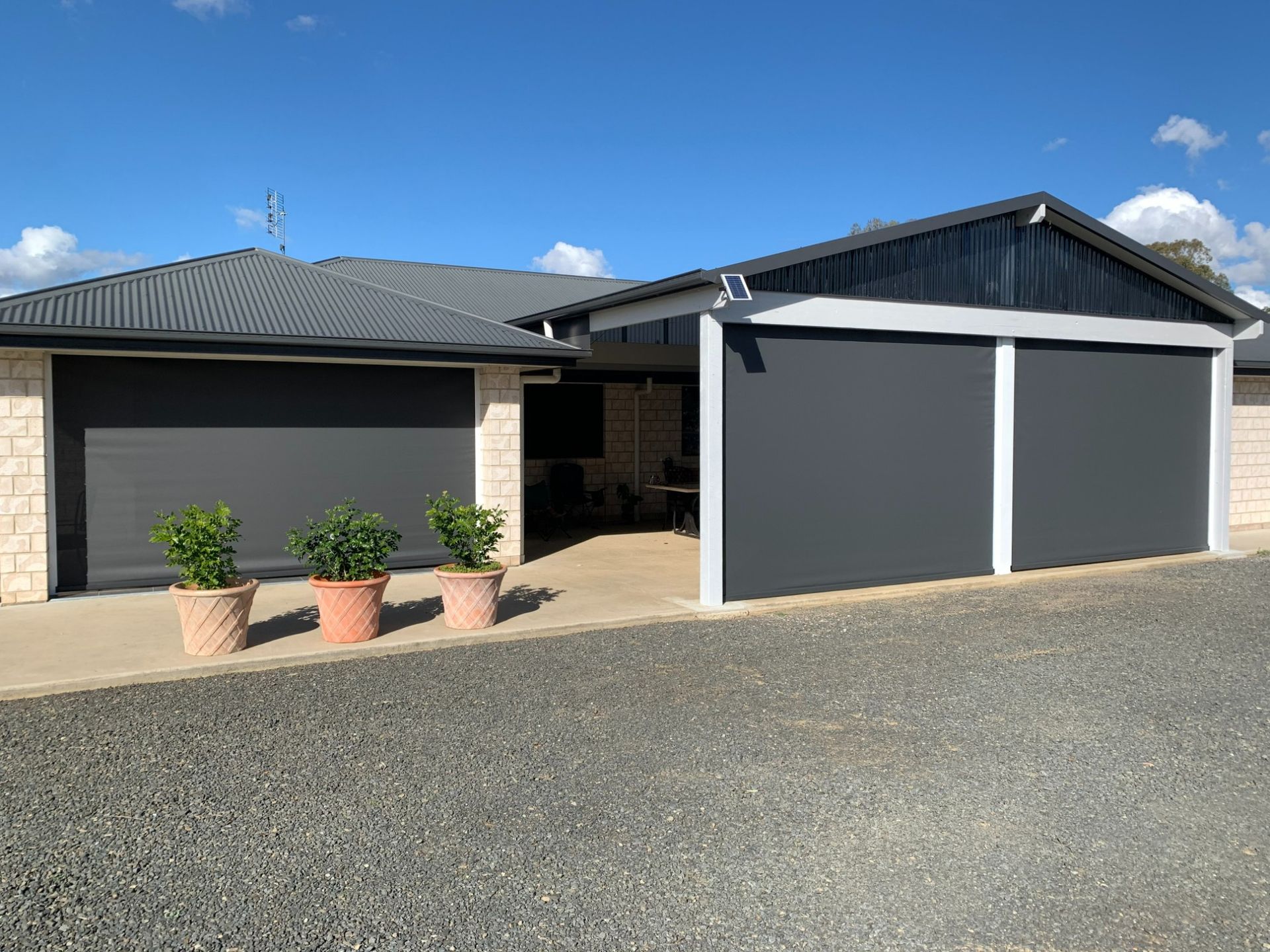 Grey Roller Shades on Garage and Walkway — Toowoomba Shade & Canvas in Warwick, QLD